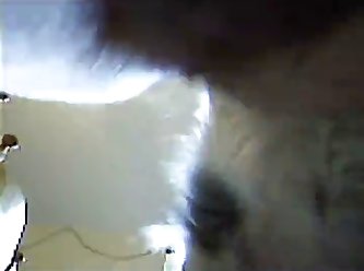 Crouching And Pointing With His Finger As He Held The Clipboard